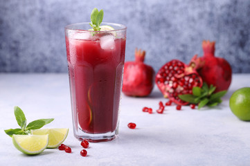 A cold, refreshing, delicious cocktail made from natural pomegranate juice, lime, mint and ice cubes, a healthy and vitamin-rich drink to quench your thirst in summer.