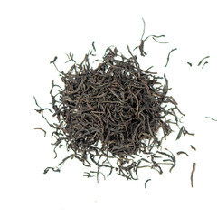 pile of natural whole leaf alpine Ceylon black tea isolated on white background