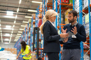 Fototapeta na wymiar Managers in Warehouse discuss about business strategy
