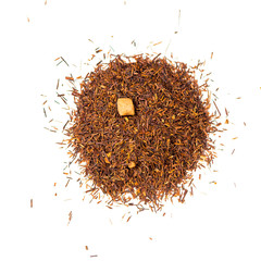 pile of natural rooibos caramel tea isolated on white background