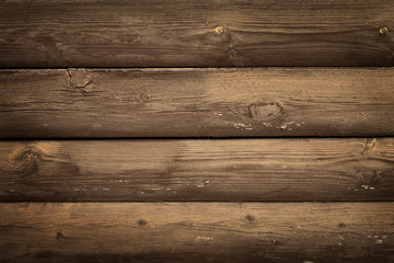 Fototapeta premium Wall of horizontal old rustic brown boards with peeling paint. Abstract modern trendy wood texture background