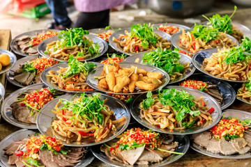 Delicious pork ear snacks and fried chicken skewers.Chinese food.