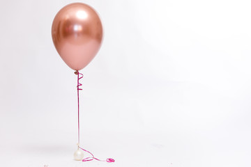 Stylish metallic pink balloons for Valentine's day, hen party or baby shower on a white background.