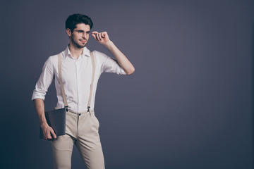 Fototapeta premium Portrait of gorgeous man entrepreneur ready work in startup hold laptop stare copyspace touch spectacles wear classy outfit isolated over grey color background