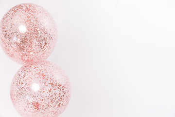 Stylish metallic pink balloons with rose gold confetti for Valentine's day, hen party or baby shower on a white background.