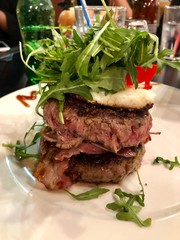grilled beef steak with eggs and salad