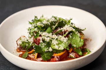 Healthy vegetable salad with grated cheese, close-up