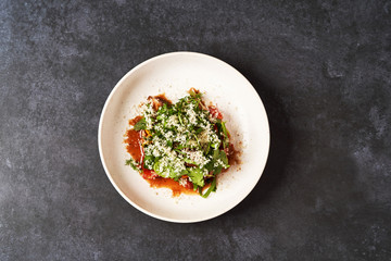 Healthy vegetable salad with grated cheese, close-up