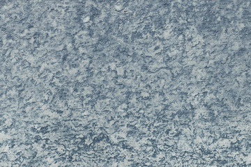 Close up of gray cement plaster on a wall outside a building. Abstract modern trendy texture background