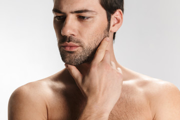 Fototapeta premium Photo of confident half-naked man posing and looking aside