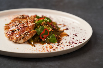 Spicy chicken breast with minted green beans, close-up