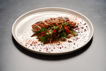 Spicy chicken breast with minted green beans, close-up