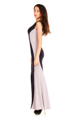 Portrait in full growth of a young woman in long evening dress