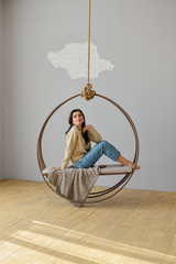 woman posing on a swing