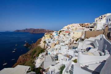 Blue and white colours of Oia City. Magnificent panorama of the island of Santorini Greece during a beautiful sunset in the Mediterranean. Love and travel background