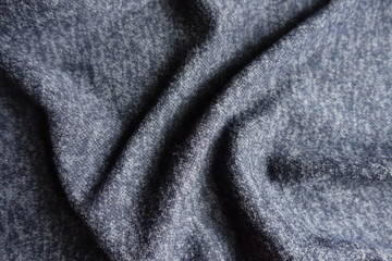 Draped dark heather blue woolen fabric from above