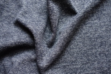 Rumpled dark heather blue woolen fabric from above