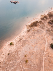 Dry summer coastline of a lake.