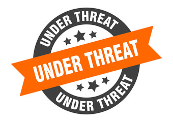 Fototapeta premium under threat sign. under threat round ribbon sticker. under threat tag