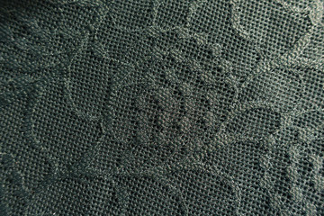 Dark green guipure lacy fabric from above