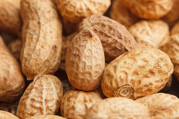 Background from golden peanuts in the shells