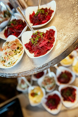 various salads as appetizers in brunch buffet in restaurant .