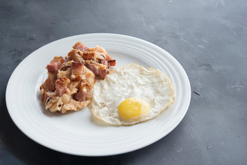 mashed potatoes with slice of bacon and egg