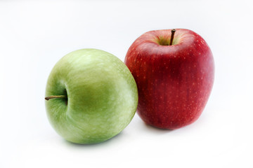 Red and green apples on a white background
