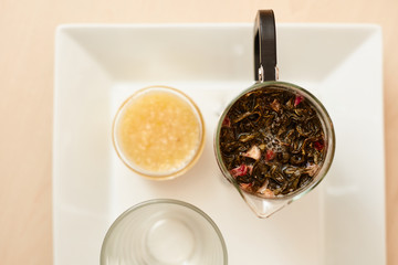 Tea with a teapot, cup and lemon jam. Natural fruit tea.