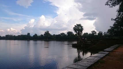 Riverside in the Angkor Park. Silhouette of the forest in the Background.
