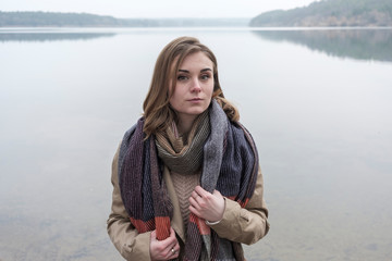 Attractive trendy young woman in winter scarf