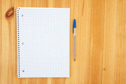 Notebook of blank graph paper and a pen