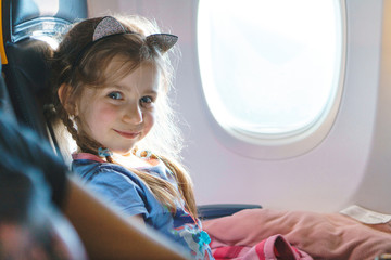 smiling girl in airplane