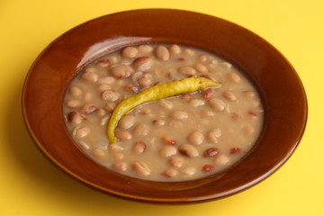 plate of red beans with chili pepper, typical Spanish dish