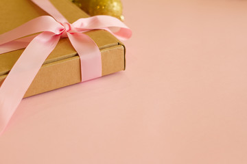 gift box with pink bow on pink background. Gift for birthday, Valentine's Day, Christmas, New year, mother's Day, women's day. Gift for people. space for text. banner. postcard.