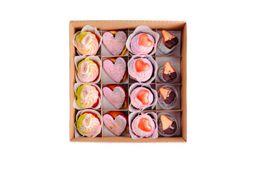 Collection of take away kraft box with delicious desserts with chocolate,raspberry,strawberry.