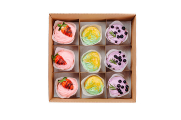 Collection of take away kraft box with delicious desserts with chocolate,raspberry,strawberry.