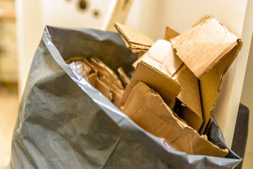 cardboard waste in plastic bag on construction site