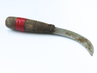 High angle view of an old rusty agricultural knife , often used for harvesting bananas and...