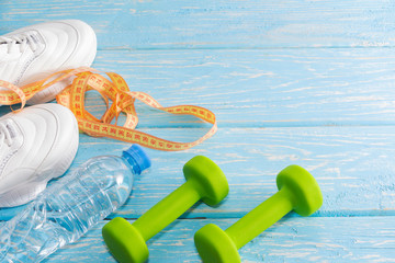 dumbbell sneakers on a bright background. Healthy lifestyle