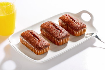 Homemade fluffy bread and biscuits on a white background