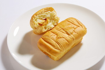 Homemade fluffy bread and biscuits on a white background