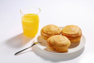 Homemade fluffy bread and biscuits on a white background