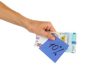 Thousand hryvnias and sticker with different financial signs and symbols in the hand