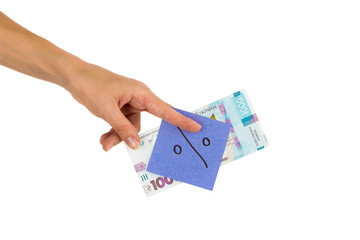 Thousand hryvnias and sticker with different financial signs and symbols in the hand