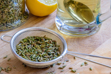 fennel seeds inside sieve being brewed for healthy drink