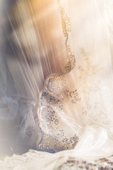 Sunlight filtering through a wedding dress