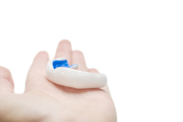 Hand with white sport mouthguard