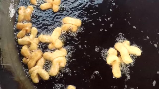 Deep-fried dough stick fried in hot oil on the pan. Deep-fried dough stick there are breakfast for Asian people.