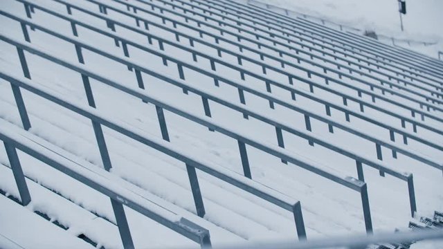 Empty Holmenkollen by night with light snowfall. Very graphic and artistic shots of a silent arena